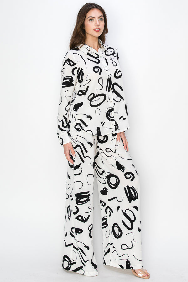 • SKU: T5394, P2231 • S-M-L (2-2-2) • Hand wash only •This blouse is characterized by its unique print, which consists of black irregular shapes against a white background. The irregular shapes create an abstract and avant-garde aesthetic, adding an element of intrigue and modernity to the garment. high quality & wholesale price w/ onenmoreusa.com