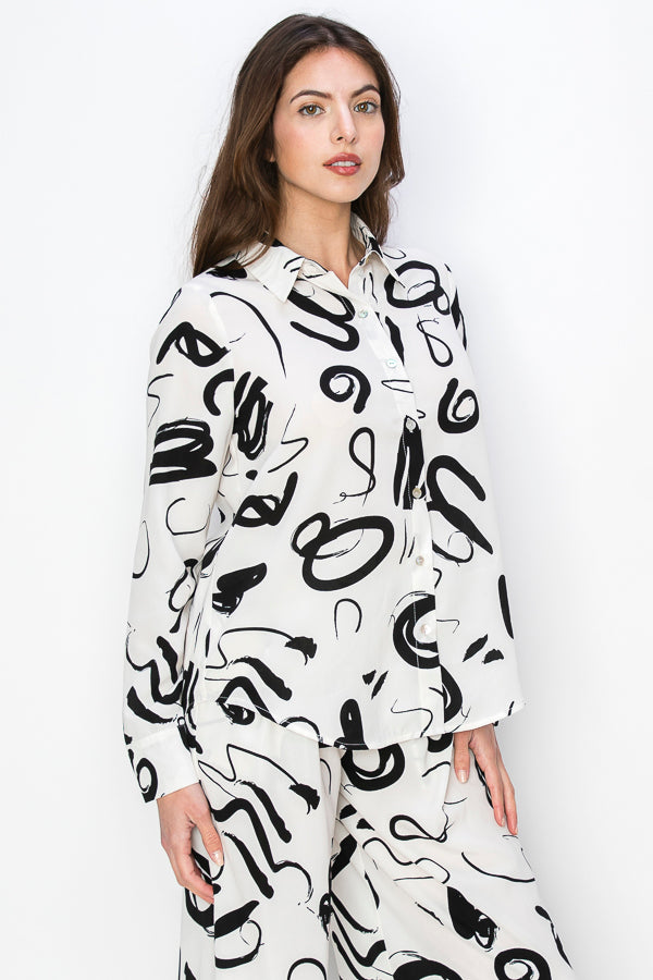 • SKU: T5394, P2231 • S-M-L (2-2-2) • Hand wash only •This blouse is characterized by its unique print, which consists of black irregular shapes against a white background. The irregular shapes create an abstract and avant-garde aesthetic, adding an element of intrigue and modernity to the garment. high quality & wholesale price w/ onenmoreusa.com