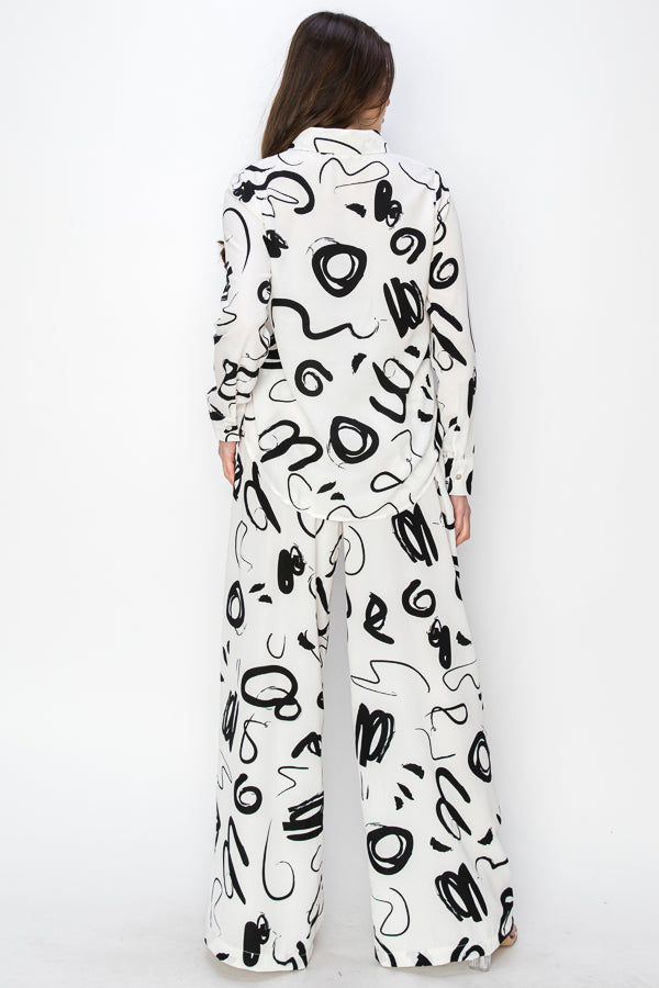 • SKU: T5394, P2231 • S-M-L (2-2-2) • Hand wash only •This blouse is characterized by its unique print, which consists of black irregular shapes against a white background. The irregular shapes create an abstract and avant-garde aesthetic, adding an element of intrigue and modernity to the garment. high quality & wholesale price w/ onenmoreusa.com