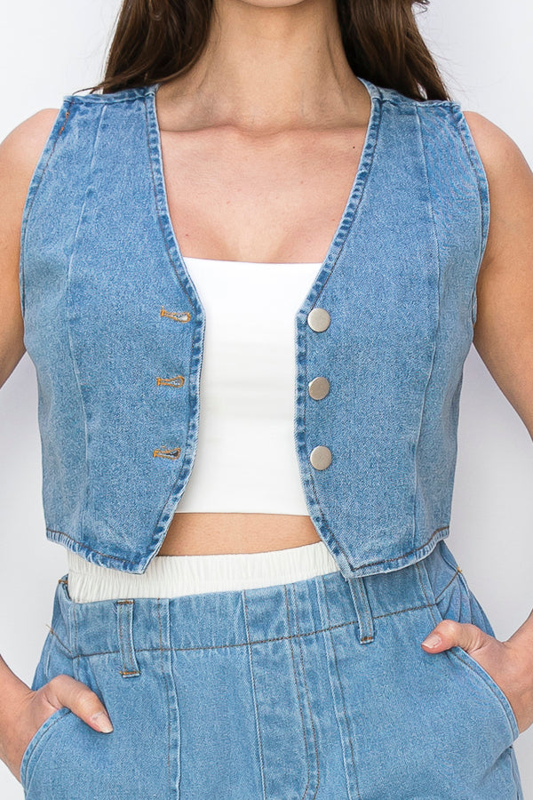 • SKU: V4134P2191-SET• S-M-L (2-2-2)• Hand wash only• This garment is a denim vest crafted from denim fabric, featuring a sleeveless design. It has a button-up front closure with three buttons, allowing for easy fastening. Unlike some vests, it does not include pockets, providing a sleek and minimalist aesthetic. • The denim material lends a casual and rugged vibe to the vest, making it a versatile piece that can be styled in various ways.